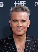 How Robbie Williams Became a Multi-Millionaire Musician